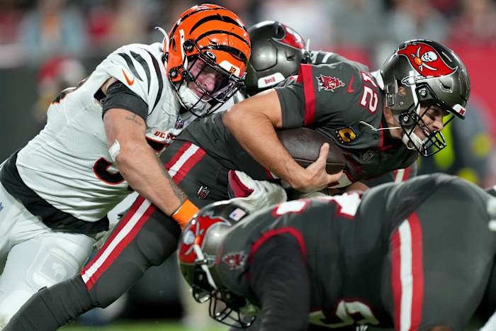 Cincinnati Bengals linebacker Logan Wilson (55) sacks Tampa Bay Buccaneers quarterback Tom Brady (12) in the third quarter during a Week 15 NFL game, Sunday, Dec. 18, 2022, at Raymond James Stadium in Tampa, Fla. The Cincinnati Bengals won, 34-23. The Cincinnati Bengals improved to 10-4 on the season. Nfl Cincinnati Bengals At Tampa Bay Buccaneers Dec 18 0097